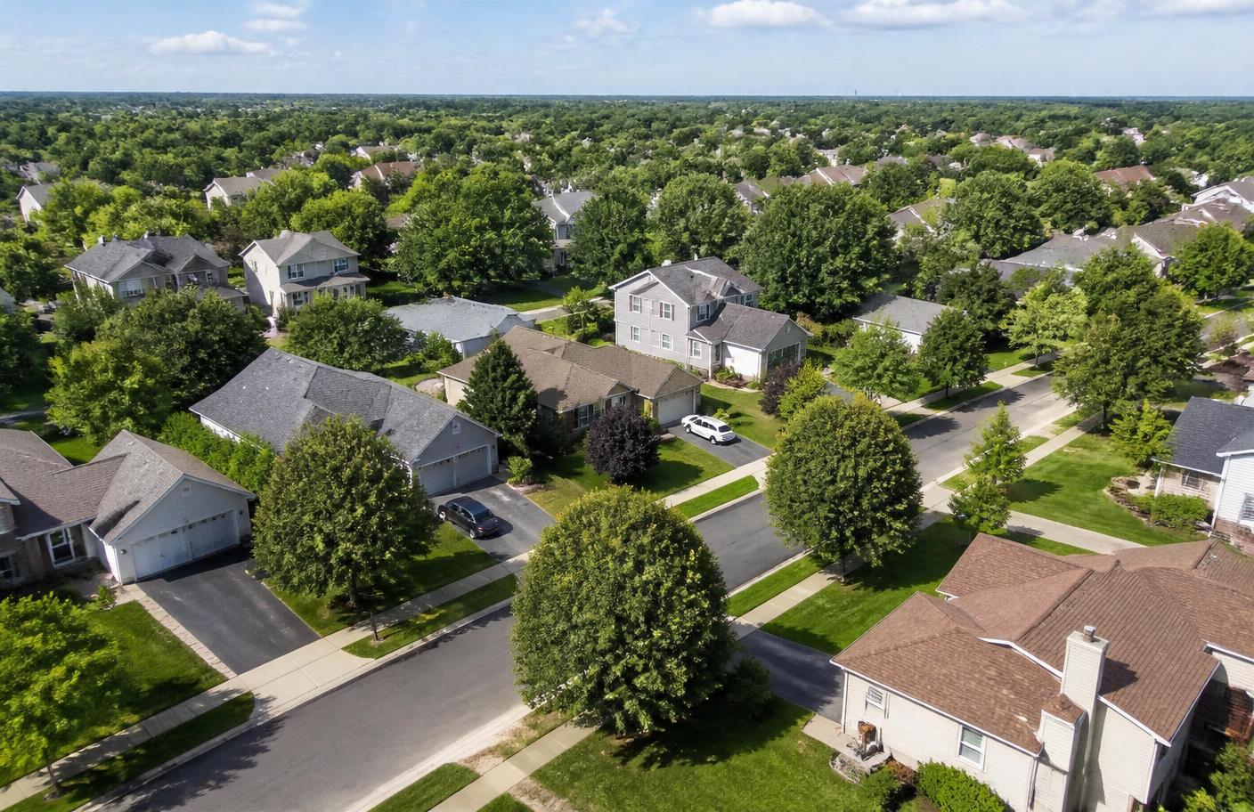 Aerial view of a quiet American suburban neighborhood on a sunny day