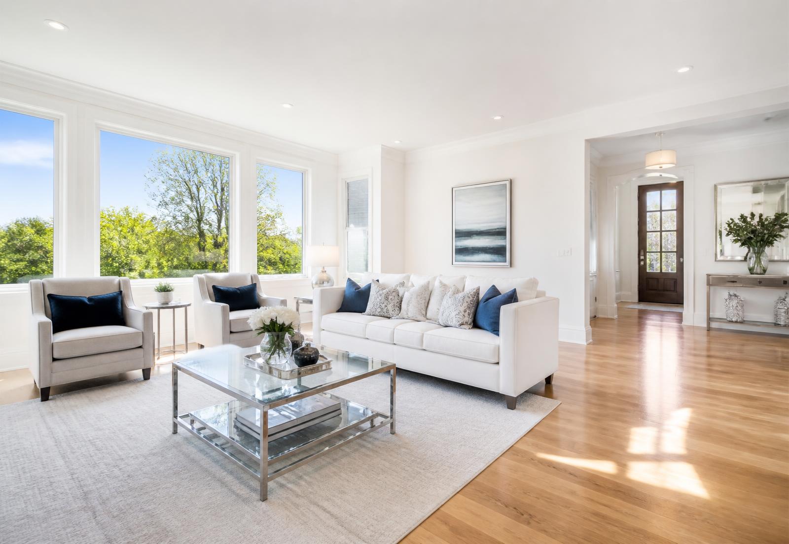 Bright, freshly cleaned modern living room with sunlight and spotless floors